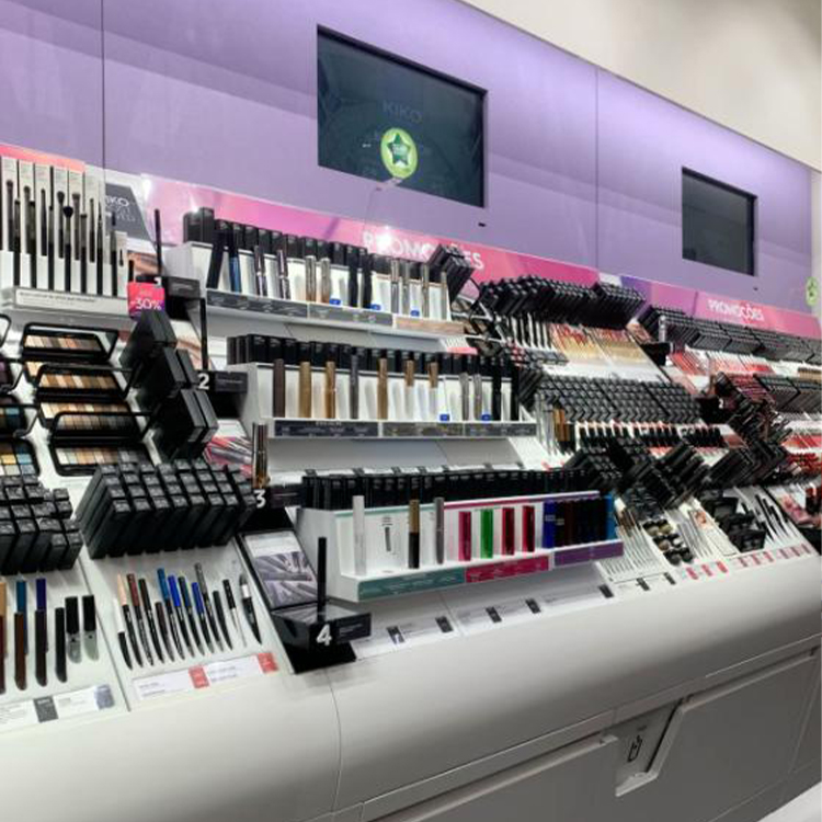 Cosmetics display shelving with illuminated product presentation areas